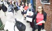 Teacher Pia Martin greets students as they arrive to school at the Science Leadership Academy as teachers take part in "A Day Without a Woman" demonstration in Philadelphia, Wednesday, March 8, 2017. Organizers of January's Women's March are calling on women to stay home from work and not spend money in stores or online to show their impact on American society. (AP Photo/Matt Rourke) Teacher Pia Martin greets students as they arrive to school at the Science Leadership Academy as teachers take part in "A Day Without a Woman" demonstration in Philadelphia, Wednesday, March 8, 2017. Organizers of January's Women's March are calling on women to stay home from work and not spend money in stores or online to show their impact on American society. (AP Photo/Matt Rourke)