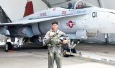 Daniel McMoore with a U.S. Navy fighter jet