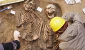 Dead men do tell tales through their physical remains. AP Photo/Francesco Bellini Two skeletons beind excavated