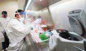 State Microbiologist Mark Nagata demonstrates extracting nucleic acid at the Hawaii State Laboratory
