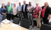 USDA Western Regional Administrator Jesus Mendoza (4th from left) with DHSS director Muavaefaatasi John E. Suisala (4th from right) and his staff in
