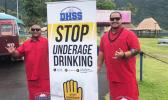 DHSS staff with prevent underage drinking sign