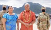 Two soldiers in uniform in the background during the American Samoa roll call at the DNC