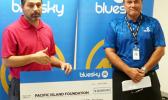 Ethan Lake (left) accepting a $20,600 contribution from Bluesky Pacific Group chief executive officer Toleafoa Tiafau Douglas Creevey 