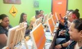 A group of friends each painting a picture