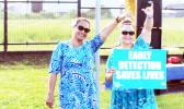Two women with early detection sign