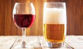 Red wine glass and glass of light beer