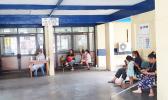 Mothers and children waiting at a hospital in Apia. 