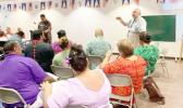 Chief Election Officer, Dr. Lealofi Uiagalelei with poll workers in a file photo taken prior to the election. 