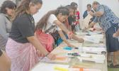 Samoan youth in Hawaii making Elei prints