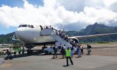 Some of the 29 missionaries boarding the charter flight