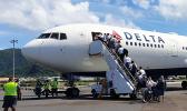 The last of the 29 missionaries of the Church of Jesus Christ of Latter Day Saints boarding the Delta Air Lines charter flight