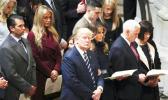 In this Jan. 21, 2017, file photo, President Donald Trump, center, accompanied by first lady Melania Trump, third from right, Vice President Mike Pence, second from right, and his wife Karen, right, and the Trump family, glances towards the balcony during a National Prayer Service at the National Cathedral, in Washington. Some websites published false stories in April 2017 claiming Trump and Pence consoled Jehovah's Witnesses by praying with them after Russia banned the religion’s members from operating anywhere in the country. Several stories included images of Trump and Pence at the National Prayer Service, falsely claiming the images were of the leaders praying with Jehovah's Witnesses. (AP Photo/Manuel Balce Ceneta, File) In this Jan. 21, 2017, file photo, President Donald Trump, center, accompanied by first lady Melania Trump, third from right, Vice President Mike Pence, second from right, and his wife Karen, right, and the Trump family, glances towards the balcony during a National Prayer Service at the National Cathedral, in Washington. Some websites published false stories in April 2017 claiming Trump and Pence consoled Jehovah's Witnesses by praying with them after Russia banned the religion’s members from operating an