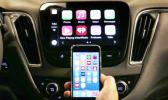 In this May 26, 2015 file photo, an iPhone is connected to a 2016 Chevrolet Malibu equipped with Apple CarPlay apps, displayed on the car's MyLink screen, top, during a demonstration in Detroit. The rapidly evolving in-car infotainment and navigation systems can be bewildering for all but the most tech-savvy car buyers. The average vehicle on U.S. roads is 11 years old; that means many people last went car shopping before iPhones were invented. (AP Photo/Paul Sancya) In this May 26, 2015 file photo, an iPhone is connected to a 2016 Chevrolet Malibu equipped with Apple CarPlay apps, displayed on the car's MyLink screen, top, during a demonstration in Detroit. The rapidly evolving in-car infotainment and navigation systems can be bewildering for all but the most tech-savvy car buyers. The average vehicle on U.S. roads is 11 years old; that means many people last went car shopping before iPhones were invented. (AP Photo/Paul Sancya)