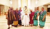 After Mass in the church, the newly ordained priest poses for a group photo with family members who were able to be present. [photo: Dann Ebina / Hawaii Catholic Herald} Father Tui and family members