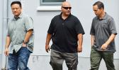 Three federal agents outside of the District Court
