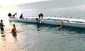 Fagaalu's Fetu ole Afiafi crew in the water with the boat