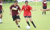 A Faga’itua player (right), dribbles against a Tafuna opponent 