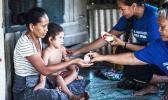 Lead coordinator Susitina Lene helps to administer treatment to a family in Leauvaa. (Photo: Misiona Simo/Samoa Observer) Lead coordinator Susitina Lene helps to administer treatment to a family in Leauvaa