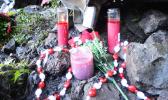 Flowers and candles were placed at the scene where two firefighters were killed