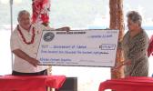 First Lady Cynthia Malala Moliga (right) presents check to PM Tuilaepa 