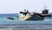 Workers prepare the 79-foot Pacific Paradise commercial fishing vessel for salvage off the shore of Honolulu, Thursday, Oct. 19, 2017. The boat that ran aground off Honolulu while transporting foreign fishermen to work in Hawaii’s commercial fishing industry has raised new questions about the safety and working conditions for foreign laborers in this unique U.S. fleet. (AP Photo/Caleb Jones) Workers prepare the 79-foot Pacific Paradise commercial fishing vessel for salvage off the shore of Honolulu, Thursday, Oct. 19, 2017. The boat that ran aground off Honolulu while transporting foreign fishermen to work in Hawaii’s commercial fishing industry has raised new questions about the safety and working conditions for foreign laborers in this unique U.S. fleet. (AP Photo/Caleb Jones)