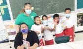 First grade students at Fitiuta hold up gifts
