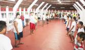 The Fetu Ole Afiafi fautasi crew warming up with stretches and other numerous strategies at the Fano Guest House in Faga’alu yesterday evening – part of their preparations for the upcoming Flag Day Fautasi Race, which is scheduled to sound off next week Friday. [photo: TG]  IMG_8846