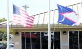 American Samoa and U.S. flags at half staff