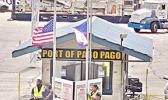American Samoa and U.S. flags at half staff at Port.