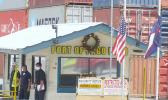 Flags lowered at entrance to port