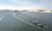 n this Monday, Aug. 27, 2018 photo provided by The Ocean Cleanup, a long floating boom that will be used to corral plastic litter in the Pacific Ocean is assembled in Alameda, Calif. Engineers will deploy a trash collection device to corral plastic litter floating between California and Hawaii in an attempt to clean up the world’s largest garbage patch. The 2,000-foot (600-meter) long floating boom will be towed Saturday, Sept. 8, 2018, from San Francisco to the Great Pacific Garbage Patch, an island of trash twice the size of Texas. (The Ocean Cleanup via AP) Floating boom that will be used to corral plastic litter