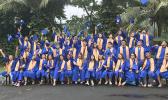 Fa’asao Marist High School 2020 graduates throwing caps in the air