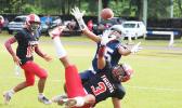 Samoana Sharks Allen Seagai (15) concentrates on trying to catch this long pass from Viliamu Tanielu,
