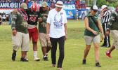 ASHSAA ATC Florence Wasko (right) and Dr. Edwards leading off the injured Manuita Sofeni of