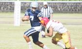 Viliamu Tanielu of the Sharks trying to evade a Tafuna defender