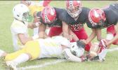 Three Faga’itua Viking defenders bringing down Livi Pearson of the Leone Lions