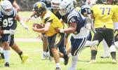 Tillus Sala of the Samoana Sharks apprehending Nathaniel Maea