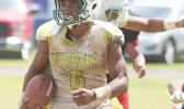 Joshua Taani of the Lions returning a kick off to midfield during