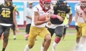 Tafuna Warriors quarterback Oakland Salave’a scrambling 