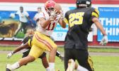 Herman Sufia (11) of the Tafuna Warriors focusing on catching this perfectly placed pass by Salave’a