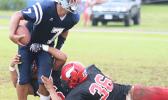 Samoana Sharks quarterback Viliamu Tanielu is sacked 
