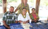 Taupau Tauleave Toluono (standing) along with ASG personnel