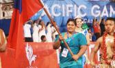 Samoan weightlifter Feagaiga Stowers carrying Samoa flag