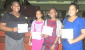 It was all smiles for these girls who received their first paycheck yesterday, for work under the Summer Youth Employment Program, administered by the Department of Human Resources. [photo: Sabrina Sinapati]