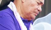 Gov. Lolo Matalasi Moliga with his eyes closed and head bowed in a silent prayer, after calling for a moment of silence to remember the victims and survivors of Hurricane Harvey, which ravaged several areas of Texas and parts of Louisiana. The governor made the call during last Friday’s annual Workforce Appreciation Day at Veterans Memorial Stadium.  [photo: Leua Aiono Frost]