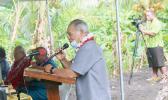Gov. Lolo Matalasi Moliga at a podium speaking