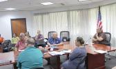 Governor with directors during virtual meeting with DOI