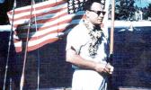 Gov. Tali Peter T. Coleman with a 48-star U.S. flag 