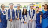 The Class of 2017 of Manumalo Academy High School with principal Tiana Trepanier (far left) and faculty members Seongshim Park and Miriam Mirasol (far right). The four graduates were all recipients of the congressional award and all of them will be continuing their education at off island colleges and universities. This is the first high school graduating class for the Flames since 2013. [photo: Blue Chen-Fruean]